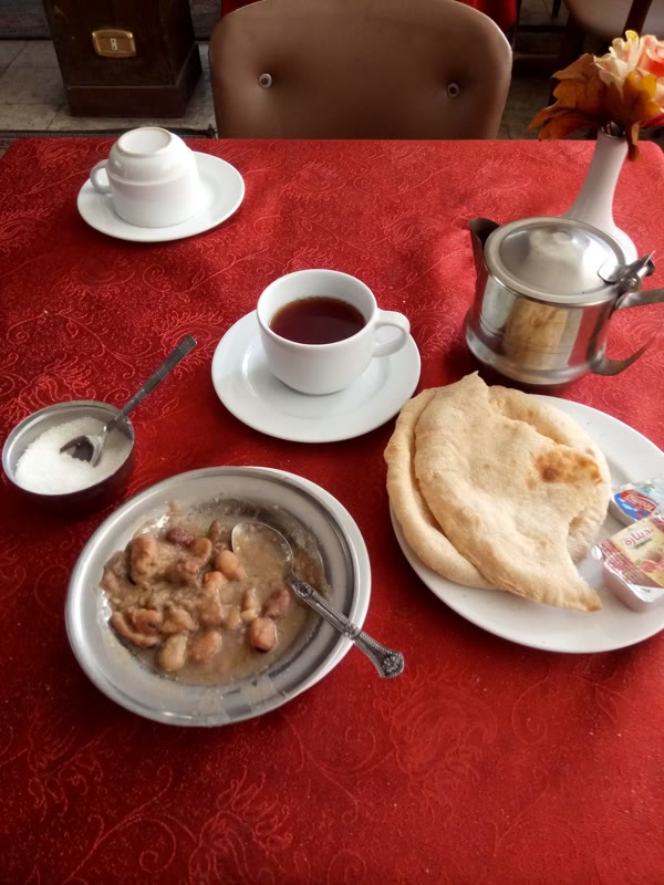 Breakfast dishes arranged on a Cairo table